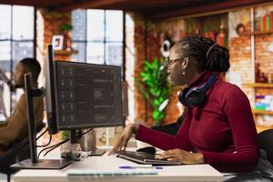 Programmer solving tasks with AI LLM chatbot answering prompts using predictive technology. Startup company worker using computer to interact with large language model program photo