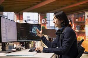 CTO manager in artificial intelligence focused startup designing, coding and debugging applications in different software languages. Chief technician officer doing code testing and quality assurance photo