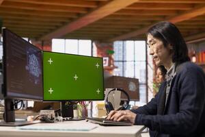 Chief technical officer uses mockup PC in AI tech agency providing software development services. Startup IT specialist uses artificial intelligence to streamline coding process on green screen PC photo