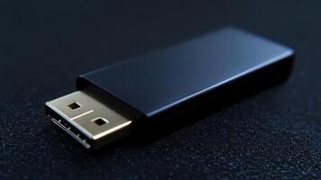 Black HDMI adapter on dark surface. photo