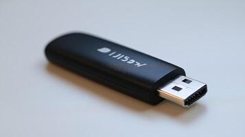 Black USB-C dongle on white background. photo