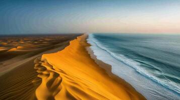 Aerial view of desert meeting ocean. photo