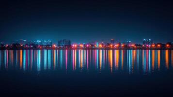 Night city skyline reflected in calm water. photo