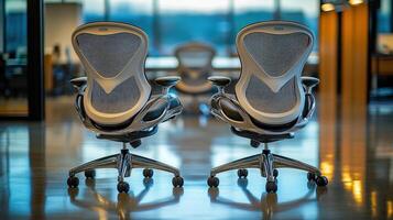Two modern office chairs back view. photo