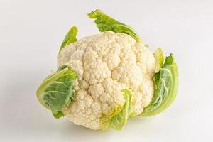 A cauliflower on a white surface photo
