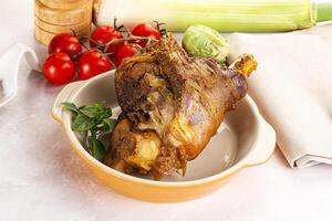 A bowl of food with a piece of meat in it photo
