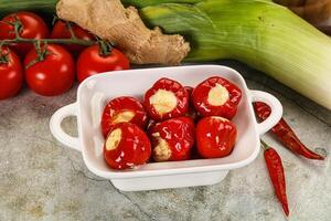 A bowl filled with tomatoes and other vegetables photo