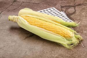 Corn on the cob on a table photo