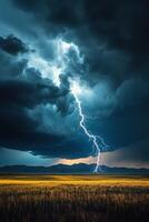 Lightning strikes over a field with a dark sky photo