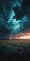A lightning bolt strikes through the sky over a field photo