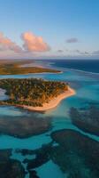 An aerial view of an island with turquoise water and white sand photo