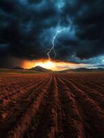 A lightning bolt strikes through the sky over a plowed field photo