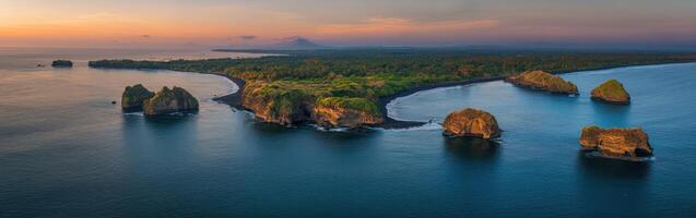 An aerial view of the ocean and some rock formations photo