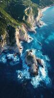 Aerial view of rocky coast and blue sea in the mediterranean sea photo