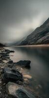 A long exposure photograph of a lake and mountains photo