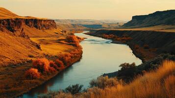 A river runs through a valley surrounded by mountains photo