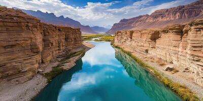 The canyon is surrounded by mountains and water photo
