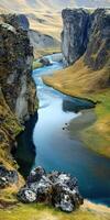 A river flowing through a valley with grass and rocks photo