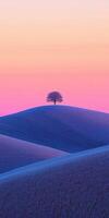 A lone tree stands alone in a field of blue and pink photo