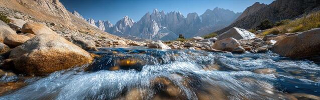 A river flowing through a rocky mountain range photo
