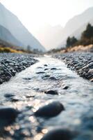 A stream running through a rocky river bed photo