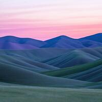 A beautiful sunset over the hills and mountains photo