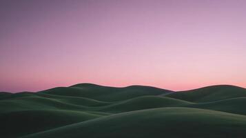 A green hill with a pink sky and purple clouds photo