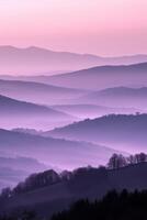 A purple sky over the hills with trees and trees photo