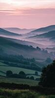 A misty landscape with hills and trees photo