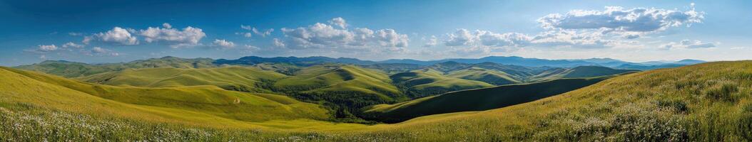 A panoramic view of the mountains and grass photo