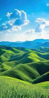 A green rolling hillside with blue sky and clouds photo
