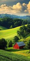 A red barn in a green field with trees and clouds photo