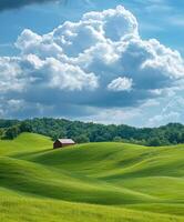 A field with a red barn in the middle photo