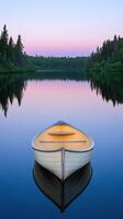 A rowboat sits on the calm waters of a lake photo