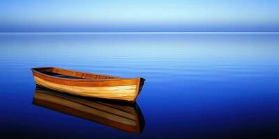 A wooden boat floating in the water on a calm day photo