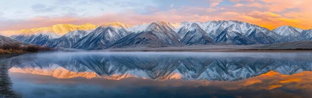 Snowy mountains at sunset photo