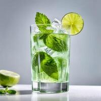 Mojito cocktail in a glass with fresh mint leaves, lime slices and ice cube. Trendy summer concept, refreshing cocktail with citrus. Design element photo