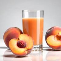 Peaches whole and half, fresh ripe fruits. Nectarine or peach juice in a glass close-up. Colorful food illustration, design element photo