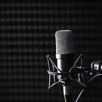 Podcast concept with copy space. Close-up microphone on the stand. On a dark background. Professional microphone on stand in recording studio, closeup. Podcast concept. photo