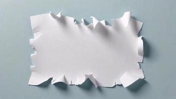 Torn White Paper on a Light Blue Background A Minimalist Abstract Image photo