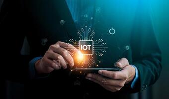 Businessman Using Digital Tablet with IoT Icon and Connected Network Symbols Representing Internet of Things Technology, Innovation, and Smart Device Integration, Digital Connectivity photo