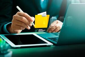 Business Professional Managing Digital Files with a Stylus on a Tablet, Highlighting Document Organization, Secure Storage, and Efficient File Management in a Technology Driven Workspace photo