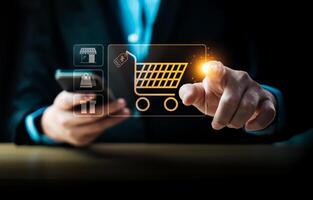 Businessman using smartphone and touching virtual shopping cart icon, representing e-commerce, online shopping, digital retail, mobile payment, consumer purchasing behavior, business technology photo