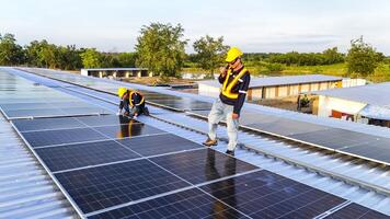 workers in safety gear installing solar panels on a rooftop, highlighting renewable energy, sustainability, and the integration of skilled labor in setting up efficient solar power systems. photo