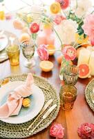 Knotted napkin lies on a plate on a mat on a set festive table photo