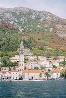 View from the sea of the high bell tower of the Church of St. Nicholas on the coast of Perast. Montenegro photo