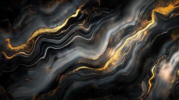 Swirling black and gray with rivers of sparkling gold create a dramatic luxurious modern abstract design photo