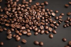 Rich, roasted coffee beans are displayed on a dark background, ready to be ground and brewed. photo