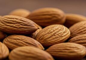 A close-up reveals the intricate texture and rich color of a cluster of healthy almonds photo