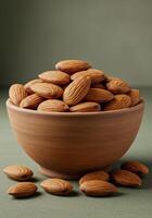 A rustic bowl overflowing with whole almonds sits elegantly on a table, perfect for healthy snacks. photo
